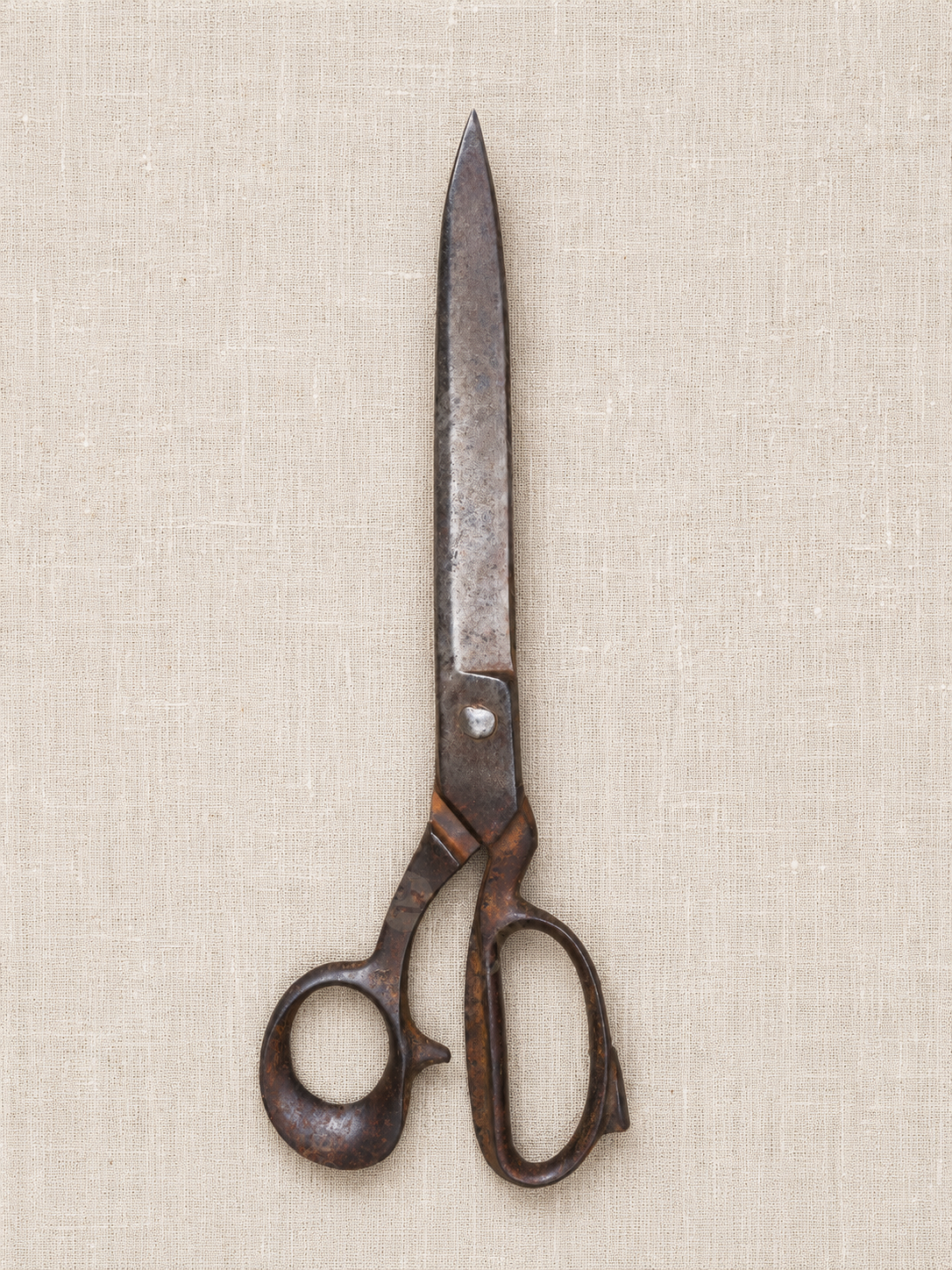Antique tailoring shears on natural linen